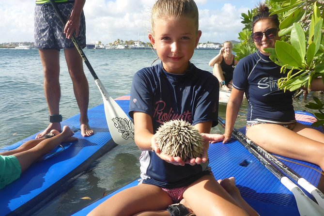 Guided paddleboarding (SUP) mangrove ECO tour for beginners - The downwind return past Spanish Water villas