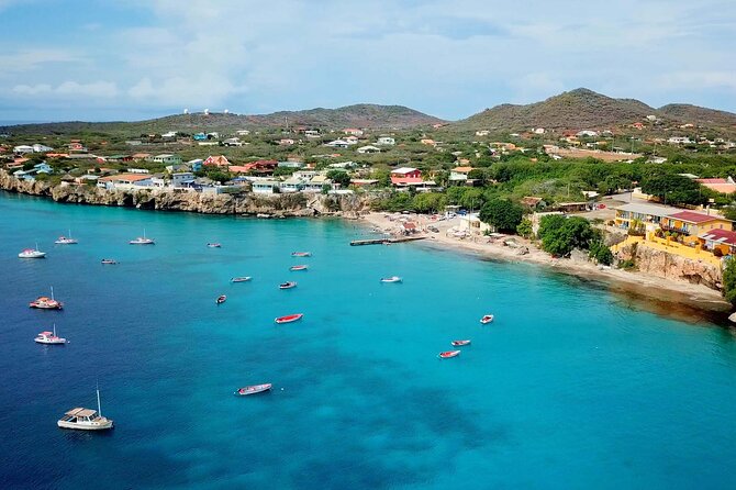 Swim with Turtles at Turtle Bay, Curacao: Boat, Blue Room Cave - Daaibooi Beach gives you a calmer final stop